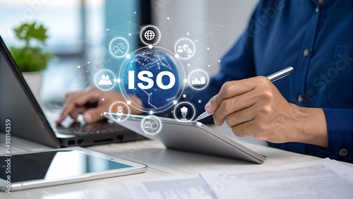 ISO Certification and quality management concept. Businesswoman uses tablet and laptop with ISO certification icons, international standards, compliance, quality management systems, certificate, photo