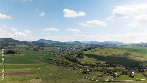 Aerial Drone Footage of Rural Poland with River, Farmland, and Country Road near Wrocław