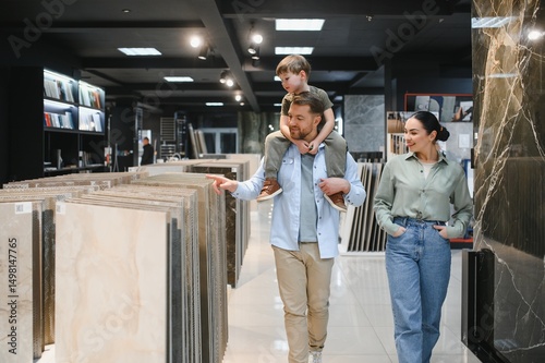Family choosing ceramic tiles in hardware store