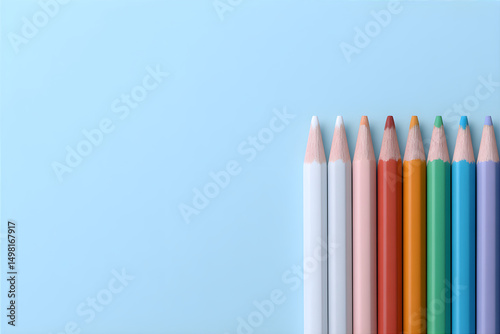 Multicolored pencils on a blue background with copy space. Banner for a children's drawing circle or a school banner