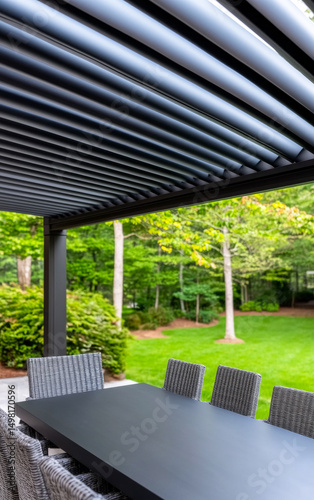 Pergola-covered outdoor dining. A sleek outdoor dining space features a spacious table and an inviting pergola surrounded by lush greenery.