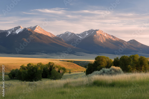 serene summer evening in mountains of montana with majestic peaks bathed in warm golden light