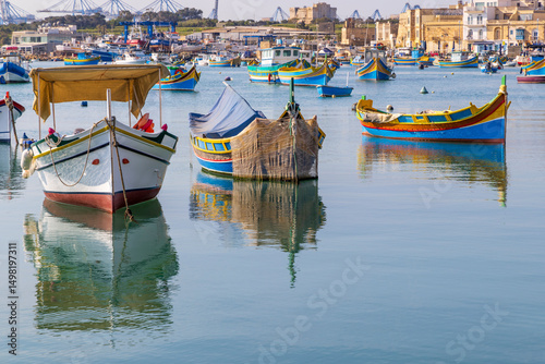 Malta, Marsaxlokk. Marsaxlokk harbor. Luzzijiet, plural of luzzu, colorful traditional Maltese fishing boats.