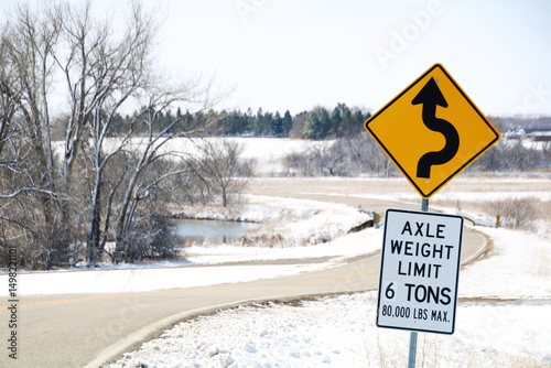 road sign on a rural road in snow