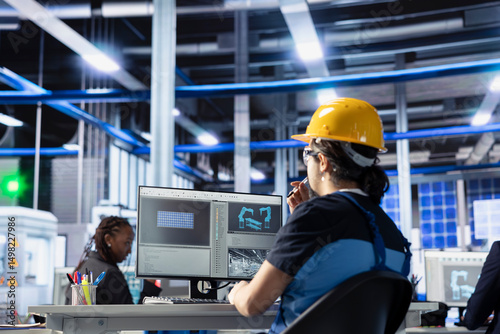 Solar panels plant technical supervisor overseeing real time energy consumption using computer. Photovoltaics factory worker ensuring optimal use of resources in solar panel manufacturing