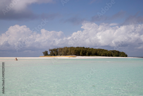 Mnemba Island, located northeast of Unguja Island, Zanzibar, Tanzania. Captured from the area of VIP beaches with restricted access, featuring shallow, crystal-clear waters and pristine sand.