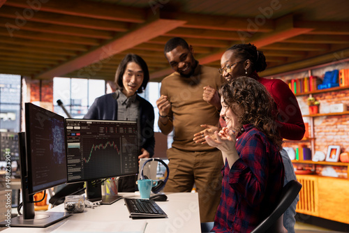 Cheerful startup team members happy after successfully launching on stock exchange, generating high profits. Jolly venture company employees delighted after securing funding from investors
