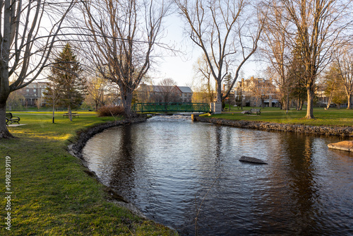 A small footbridge over a creek in spring. Stewart Park In Perth, Ontario, Canada