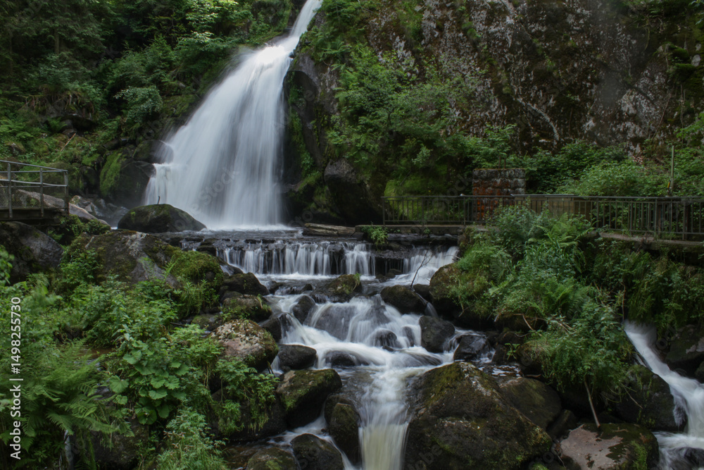 Fototapeta premium photo of cascading water fall in the Black Forest of Germany