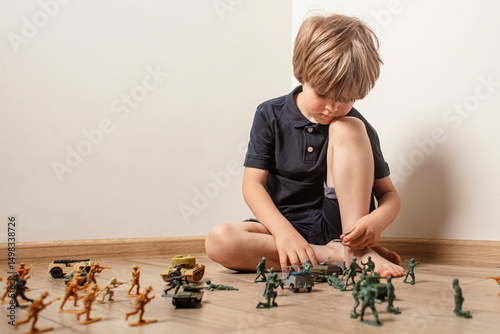 Εκτύπωση καμβά Сhildren playing with ф toy soldiers. Time for play. Free time.