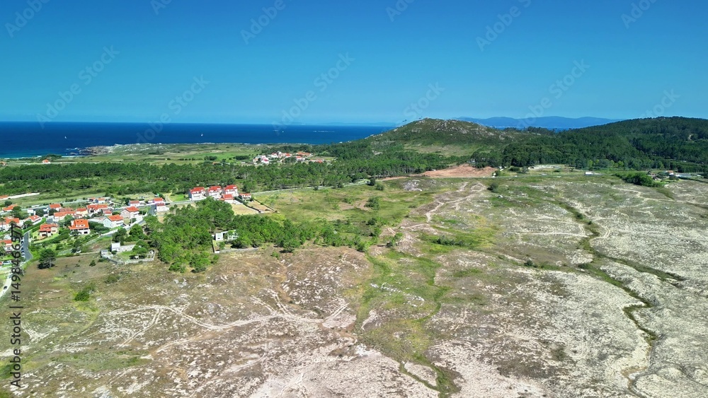 Naklejka premium Stunning Aerial View showcasing a Coastal Landscape featuring Blue Ocean and Lush Vegetation