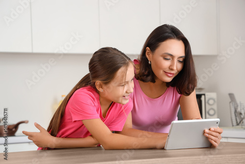 Mother and daughter using t...