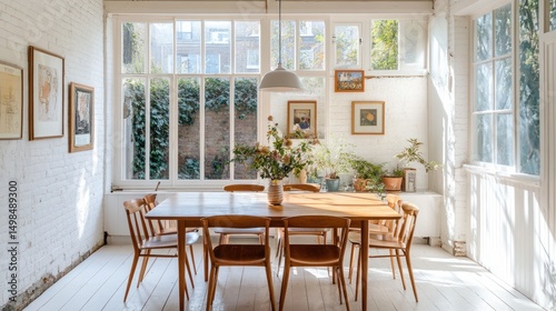 Sunlit dining room with wooden table and chairs white brick walls and greenery