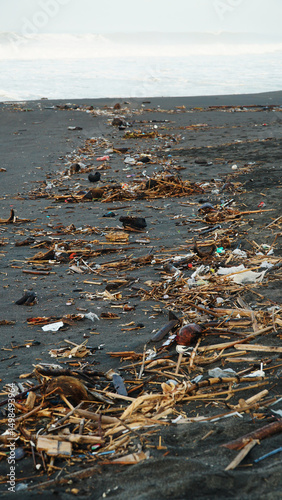 Garbage is scattered on the beach sand