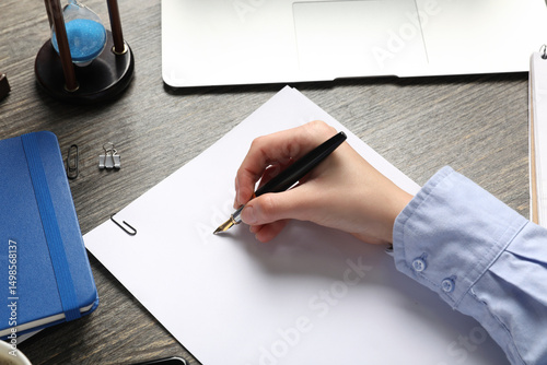 Female hand with blank pape...