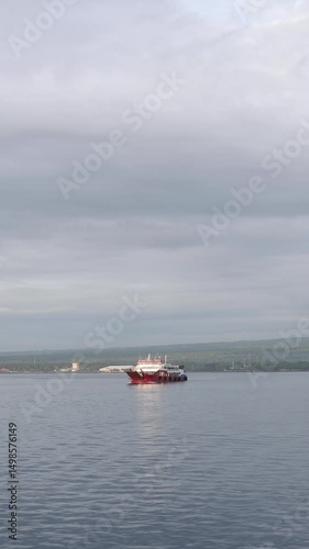 Morning Ferry on Calm Waters with Distant Shoreline
