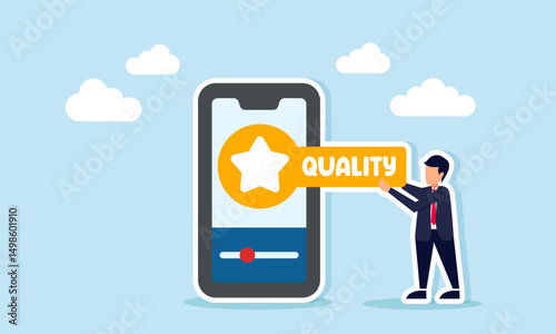 Businessman holding a board with star symbol and quality text beside smartphone illustrating business app quality standardization