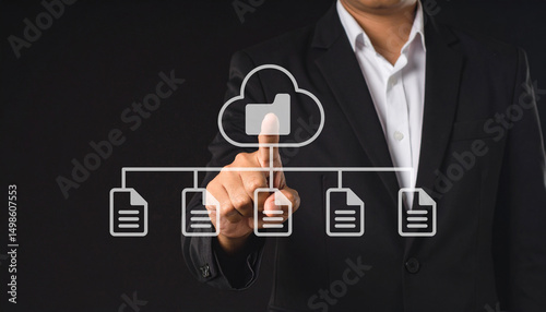 A businessman in a suit interacts with a virtual cloud storage interface, selecting a folder connected to multiple documents.