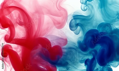Abstract image of red and blue ink swirling in water, creating dynamic, flowing patterns against a white background