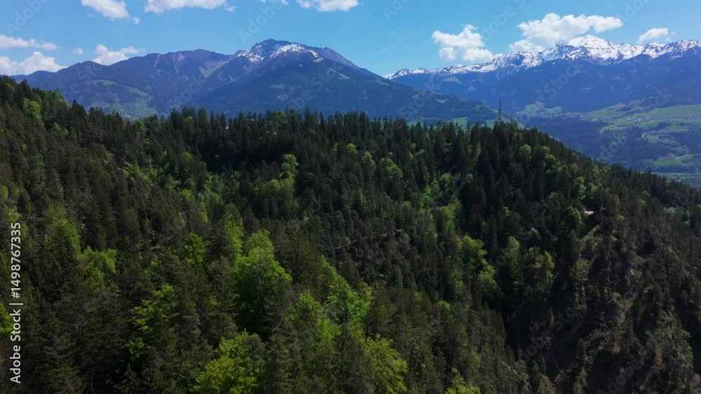 small town in the alps drone flight with blue sky in summer small town in the alps drone flight with blue sky in summer