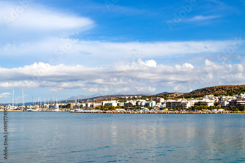 A charming seaside town that boasts calm, inviting waters, lush green hills, and an endless clear blue sky above. Greece. Rethymnon.