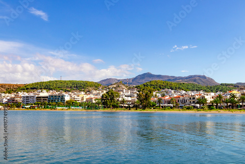 A charming seaside town that boasts calm, inviting waters, lush green hills, and an endless clear blue sky above. Greece. Rethymnon.