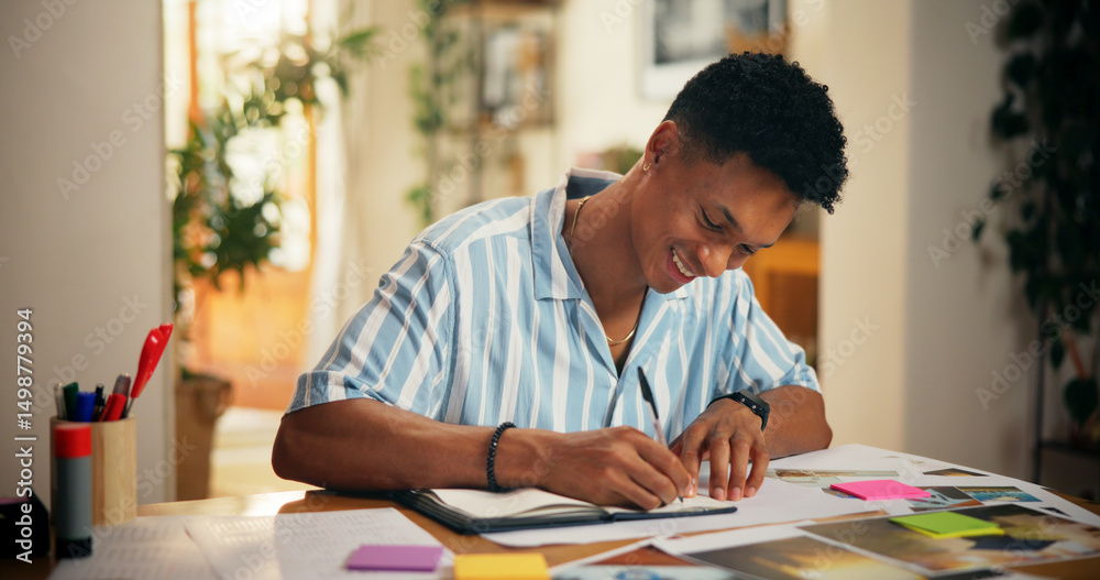 Naklejka premium Man, creative and happy with writing in home for planning vision board, goals timeline and manifestation. Poster, pictures and sticky notes for dream ideas, progress tracking or personal development