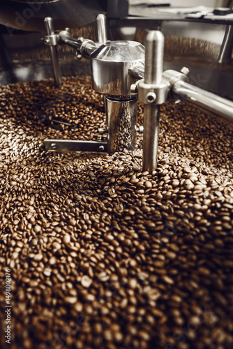 Obraz na plátně Roasted Coffee Beans on Cooling Tray Agitator