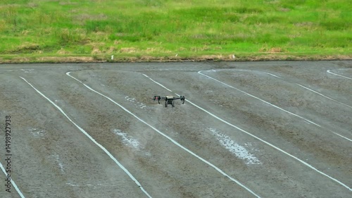 Agricultural drone precisely applies pesticides across rice paddies, demonstrating innovation in automated crop care for greater sustainability and resource efficiency.
