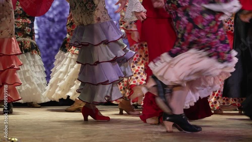 Professional flamenco dancers performing passionately in the in fair. Street performance. Traditional Spanish costumes