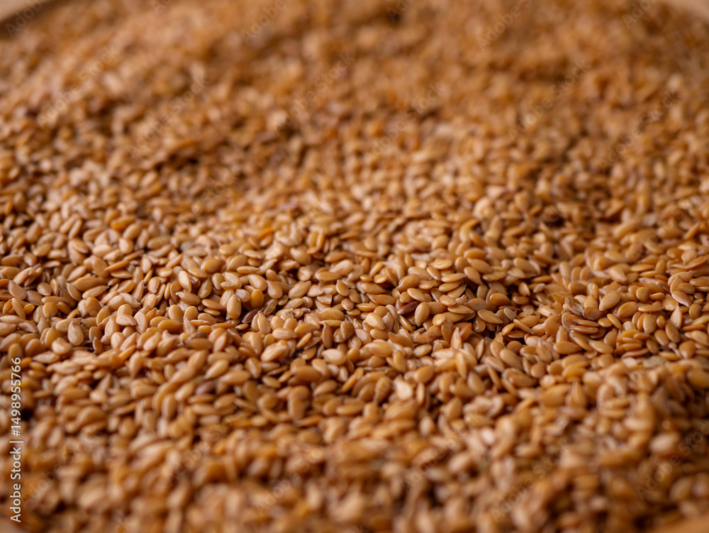 Obraz premium Organic golden flaxseed, linseed grains. Superfood high in fiber.