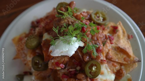 Loaded cheese and chilli nacho topping Mexican famous food