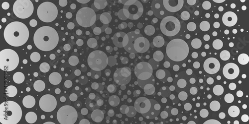 A monochromatic abstract pattern of overlapping circles with varying sizes and opacity, forming a textured and dynamic design on a dark background.