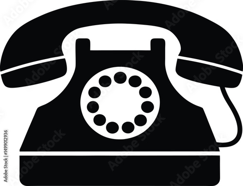 Close-up of a classic black rotary phone on a white background, evoking vintage communication and antique technology