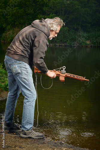 Senior citizen fishing with magnet in city lake found guns