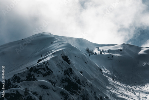 clouds over the mountains on a winter moody day