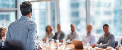 The professional leading a dynamic business meeting with engaged participants.