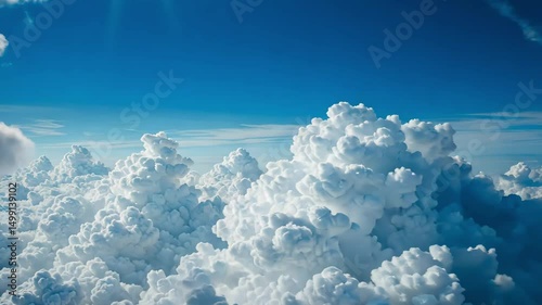 Wallpaper Mural Massive cumulus clouds forming in clear blue sky during daytime, natural weather pattern showing cloud development and bright daylight. Torontodigital.ca