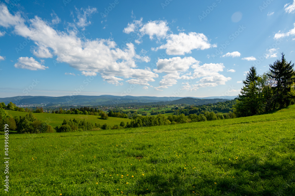 Ridge hiking trail from Javornik to Jested with scenic views into valleys and distant Jizera Mountains. Sunny summer day, peaceful nature and beautiful Czech landscape Ridge hiking trail from Javornik to Jested with scenic views into valleys and distant Jizera Mountains. Sunny summer day, peaceful nature and beautiful Czech landscape