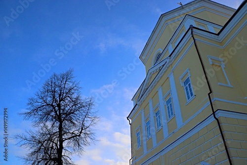 Russian Orthodox church with golden walls and a yellow cross on the dome
