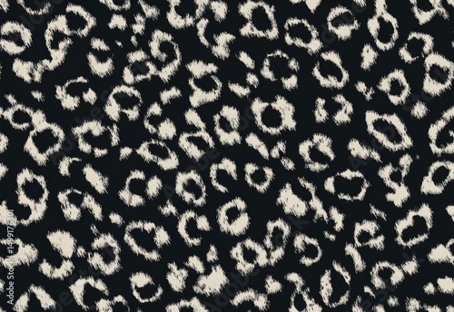 Abstract black and cream animal print pattern.