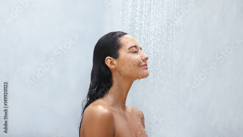 Photos Tranquil Woman Relishing a Gentle Shower with Eyes Closed