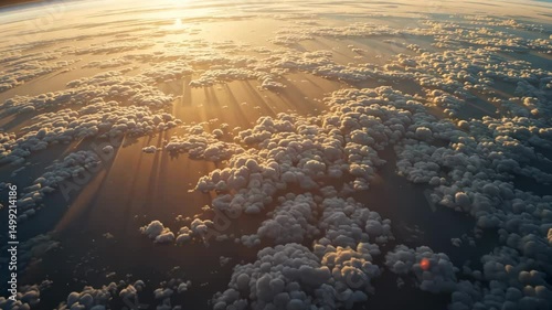 Wallpaper Mural Aerial view of golden sun rays breaking through dramatic clouds during sunrise over the sky, symbolizing peace, beauty and power of nature Torontodigital.ca