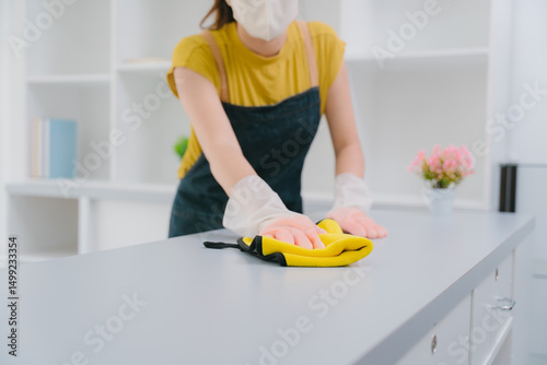 Woman Cleaning Countertop with Cloth
