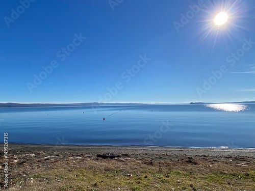 Quadro su tela Sunlight reflecting on calm Lake Bolsena waters, framing tranquil landscape near