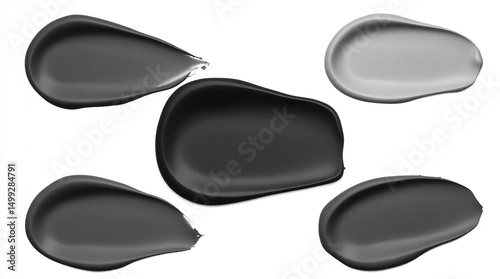 Paint and cosmetic product swatches in gray and black tones photo