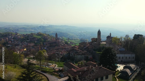 Wallpaper Mural Aerial View Of Monforte d'Alba - Picturesque Italian Village With Historic Towers, Terracotta Rooftops, And Misty Hills In Background. static drone shot Torontodigital.ca