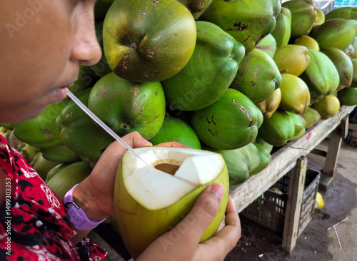 Green Fresh Coconut Drink with Straw Tropical Refreshment Natural Hydration Summer Wellness