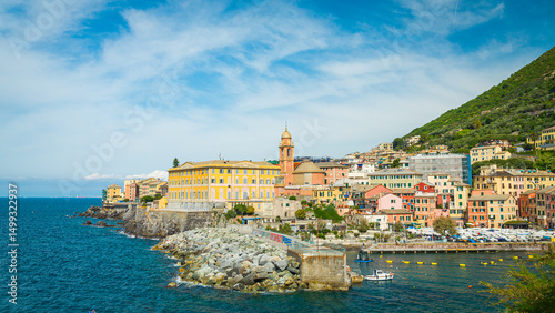 Wallpaper Mural The village of Nervi, close to Genoa, Liguria, Italy, with traditional colorful buildings. Blue waters of mediterranean sea on the left. Blue sky with white clouds on the background. Torontodigital.ca
