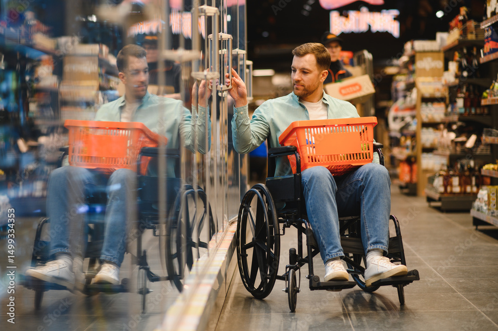 Obraz premium Customer with disability choosing frozen food in supermarket refrigerator